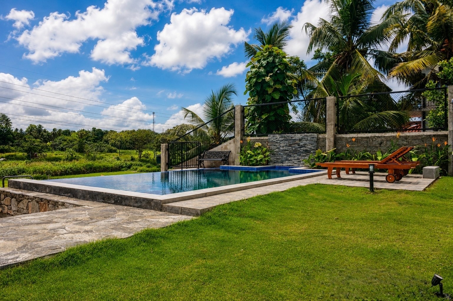 Pool and garden view at Emerald Edge Villa